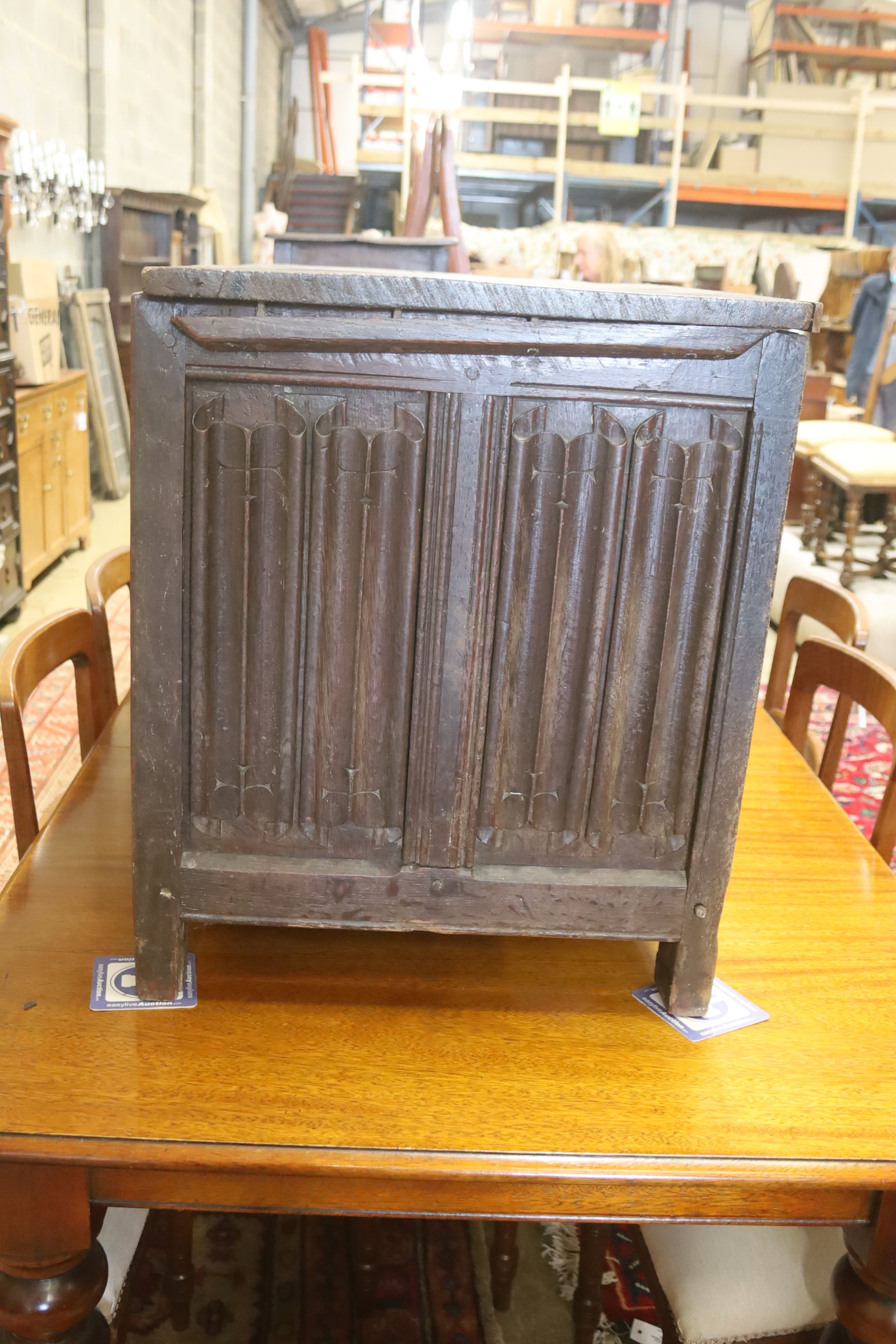 A carved and panelled oak chest, length 129cm, depth 51cm, height 63cm